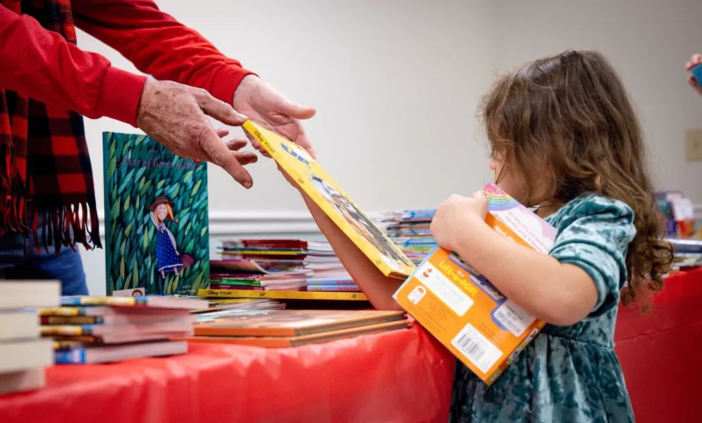 foster girl receiving toys