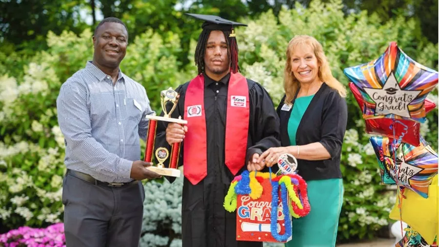Caroline from Kind to Kids with a Ugrad Graduate